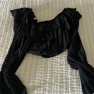 Cute black ruffle crop top with long sleeves! Worn only twice!